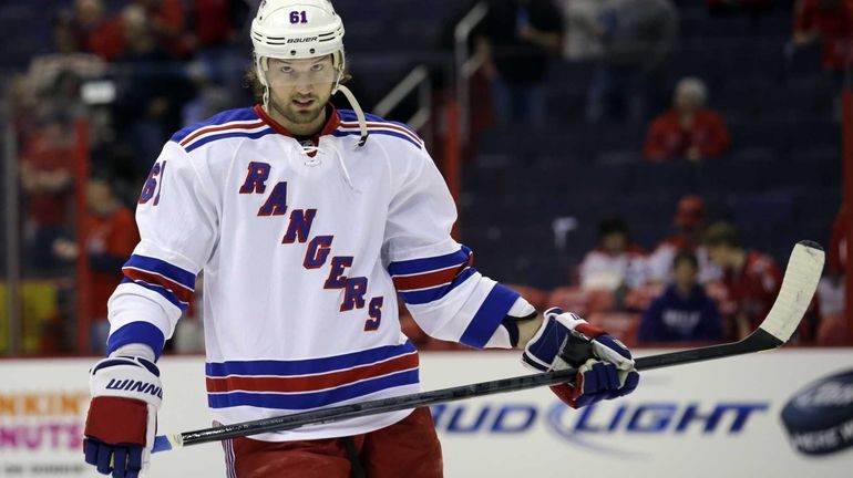 Rangers left wing Rick Nash skates on the ice before...