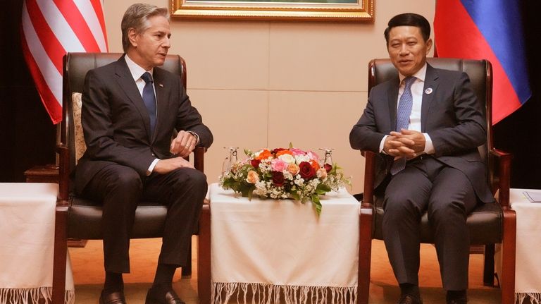 U.S. Secretary of State Antony Blinken, left, talks with Laos...