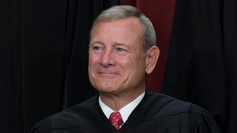 Chief Justice of the United States John Roberts joins other...