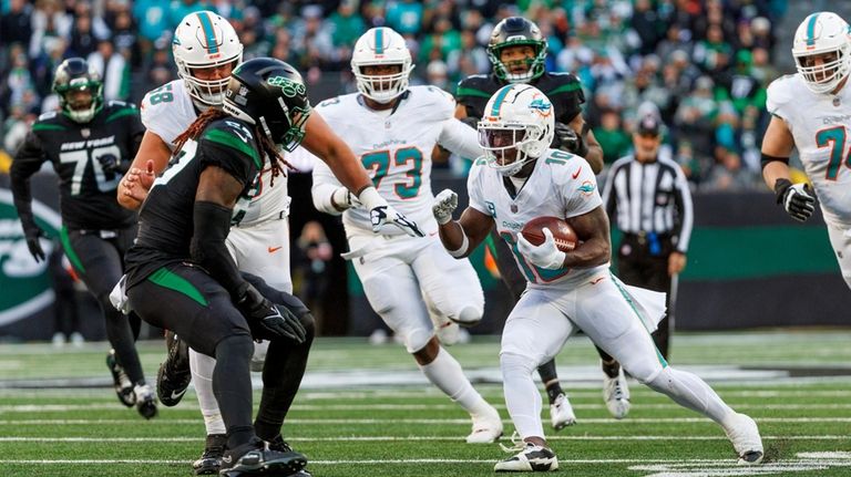 Miami Dolphins wide receiver Tyreek Hill (10) runs with the...