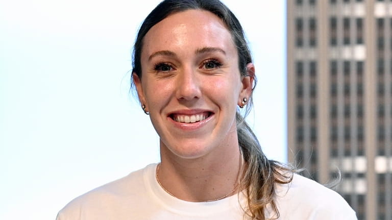 U.S. Olympic swimmer Abbey Weitzeil poses for the media at...