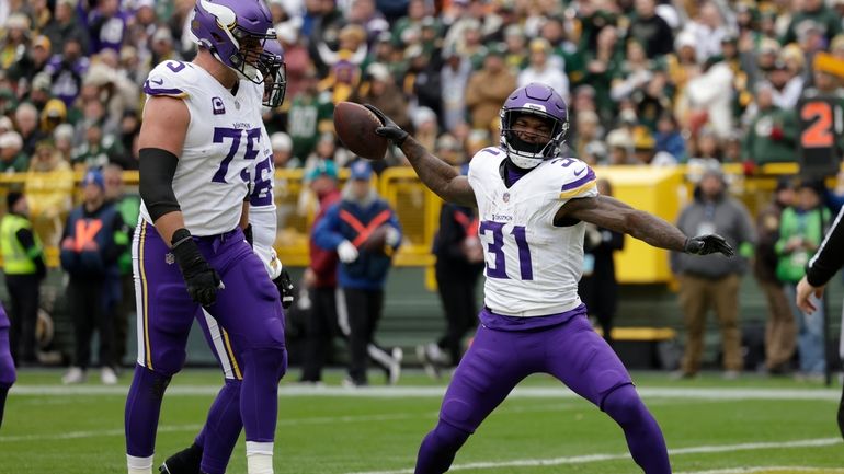 Minnesota Vikings running back Cam Akers (31) celebrates after scoring...