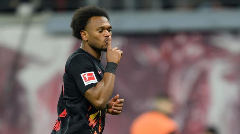 Leipzig's Lois Openda celebrates after scoring his side's second goal...