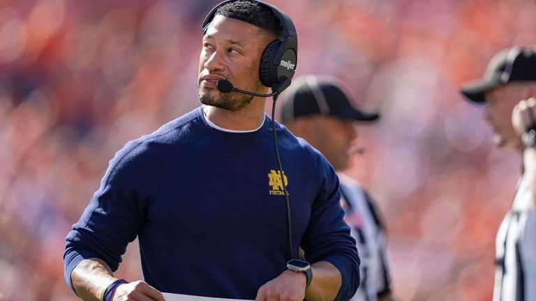 Notre Dame head coach Marcus Freeman looks on against Clemson...