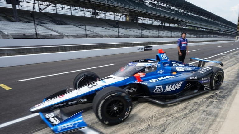 Marco Andretti leaves the pits during a practice session for...