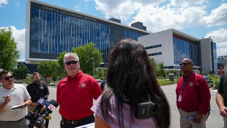 Marion County Sheriff Kerry Forestal stands outside Eskenazi Hospital and...