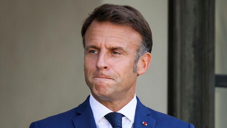 French President Emmanuel Macron gestures at the Elysee Palace as...