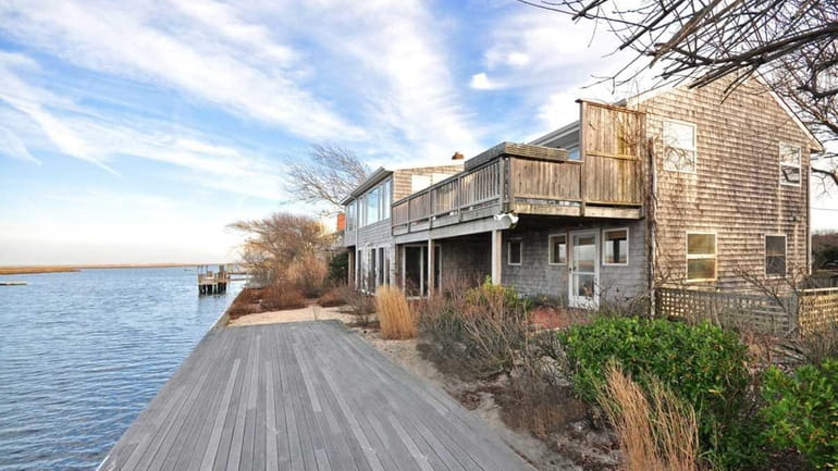 This waterfront home at 22 Broadway in Gilgo Beach is...