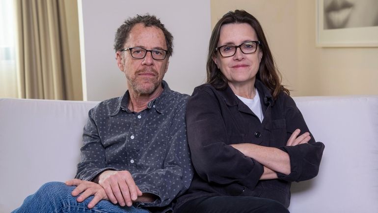 Writer/director Ethan Coen, left, and writer Tricia Cooke pose for...