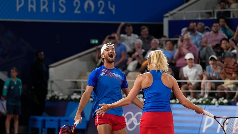 Czech Republic's Tomas Machac celebrates with Katerina Siniakova as they...