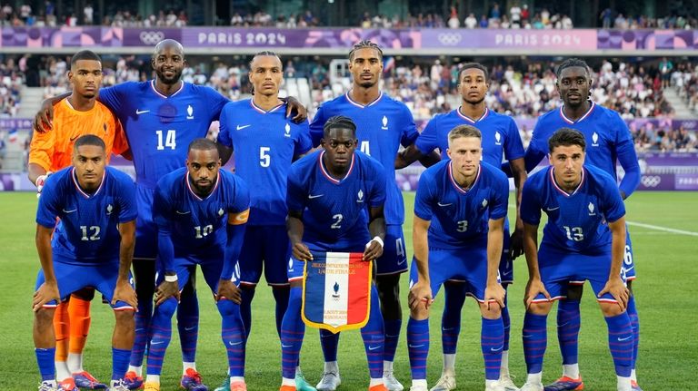 France players pose for a photo during a quarter final...