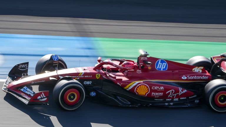 Ferrari driver Charles Leclerc of Monaco steers his car during...