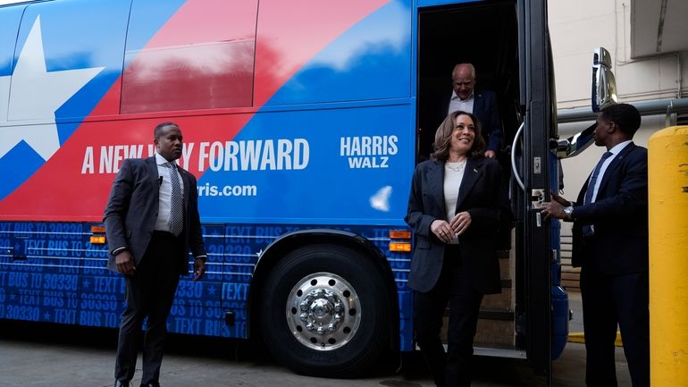 Democratic presidential nominee Vice President Kamala Harris and her running...