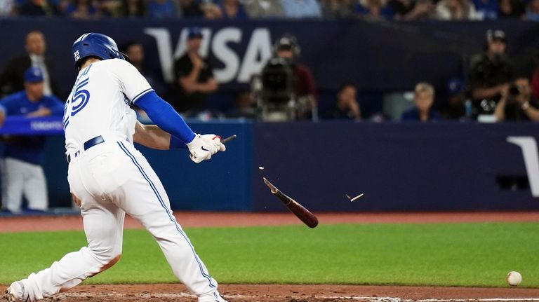 Toronto Blue Jays' Daulton Varsho breaks his bat on a...