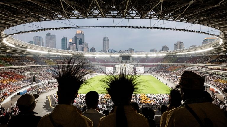 Catholic faithful attend a holy mass led by Pope Francis...