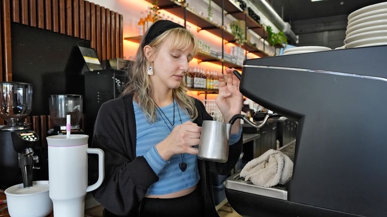 Samantha Grimison makes a cup of coffee at the Blind...