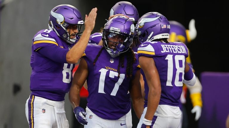 Minnesota Vikings wide receiver K.J. Osborn (17) celebrates with teammates...