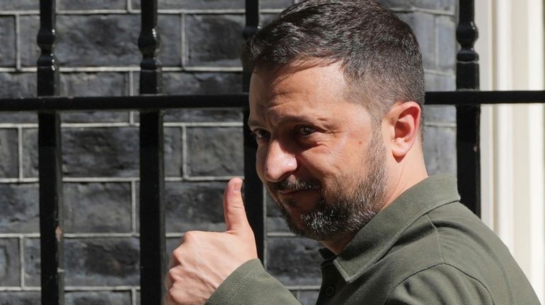 Ukraine's President Volodymyr Zelenskyy leaves Downing Street after meeting with...