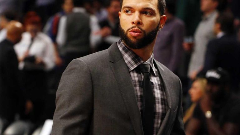 Deron Williams looks on before a game against the Knicks...