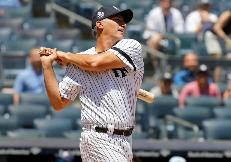 New York Yankees' Nick Swisher, left, greets Johnny Damon at the