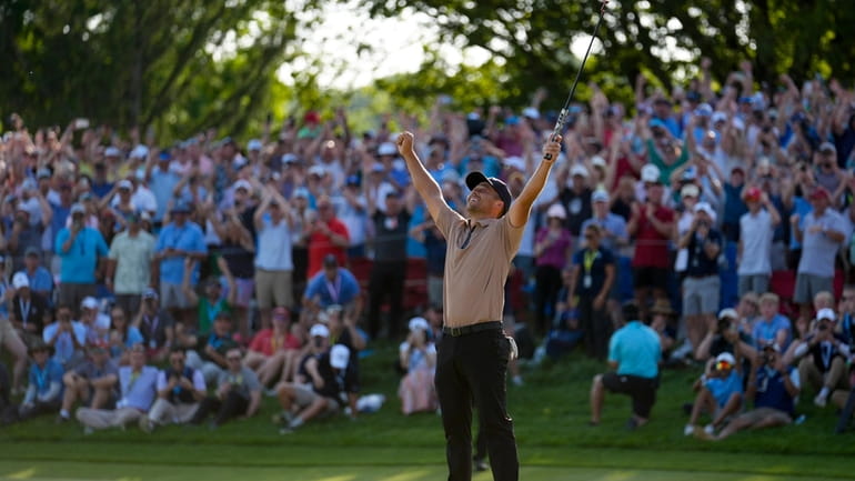 Xander Schauffele celebrates after winning the PGA Championship golf tournament...