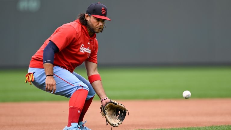 St. Louis Cardinals' Brandon Crawford takes infield practice before a...