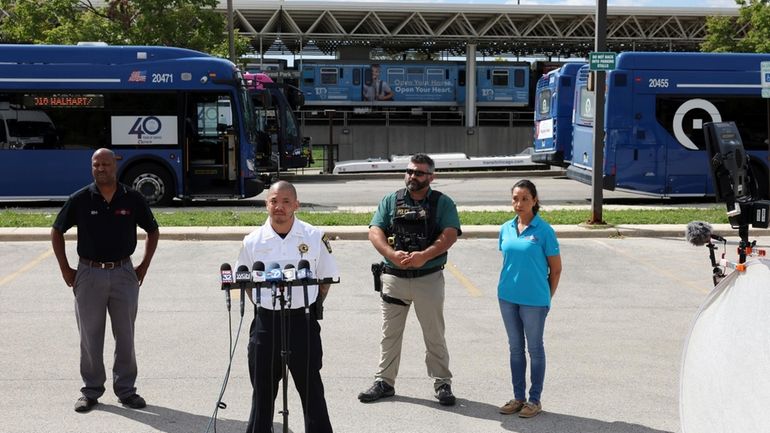 Forest Park police Deputy Chief Christopher Chin gives a news...