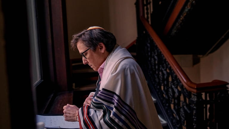 Rabbi Sharon Kleinbaum prepares for her last service at the...