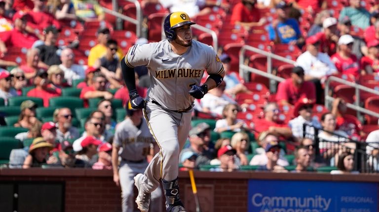 Milwaukee Brewers' Victor Caratini watches his three-run home run during...