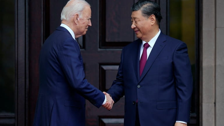 President Joe Biden greets China's President President Xi Jinping at...