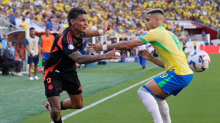 Brazil's Andreas Pereira, right, and Colombia's Richard Rios battle for...