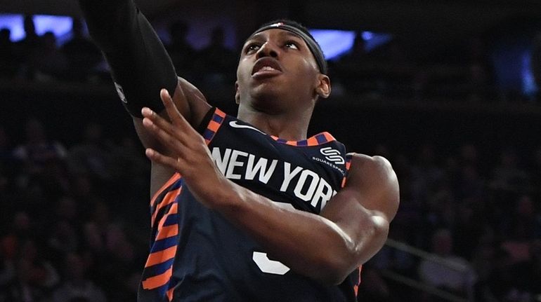 Knicks guard RJ Barrett scores a layup against the Heat...