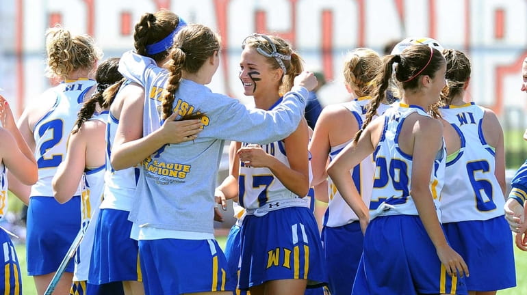 West Islip players celebrate following the game against Suffern during...