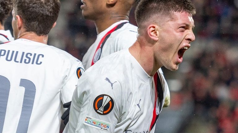 AC Milan's Luka Jovic celebrates after scoring during the Europa...