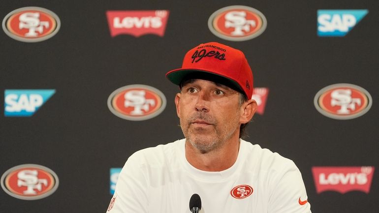 San Francisco 49ers head coach Kyle Shanahan speaks at a...