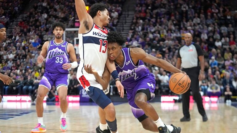 Washington Wizards guard Jordan Poole (13) fouls Utah Jazz guard...