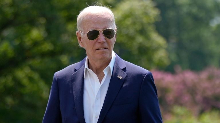 President Joe Biden arrives at the White House from Camp...