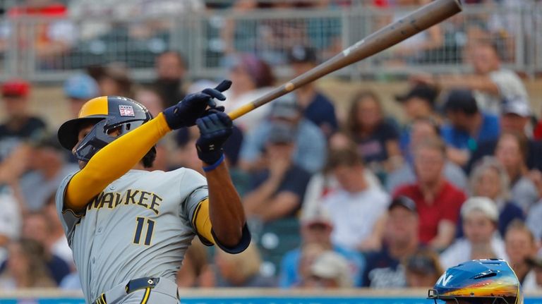 Milwaukee Brewers' Jackson Chourio follows through on an RBI single...