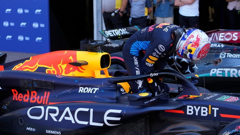 Red Bull driver Max Verstappen of the Netherlands exits his...