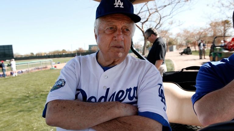 Los Angeles Dodgers Tommy Lasorda watches practice during spring training...