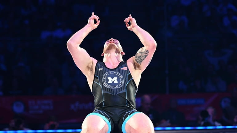 Mason Parris reacts after winning at 125 kilograms in the...