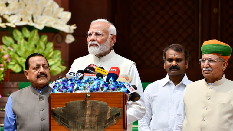 Indian Prime Minister Narendra Modi addresses the media as he...