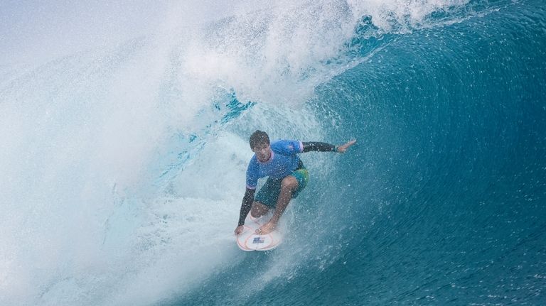 Jack Robinson, of Australia, surfs during the gold medal match...