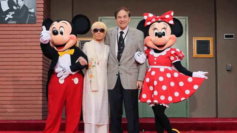 Mickey Mouse, from left, Elizabeth Gluck, Richard M. Sherman and...