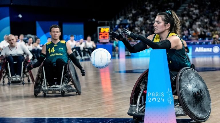 Ella Sabljak of Australia takes the ball to try during...