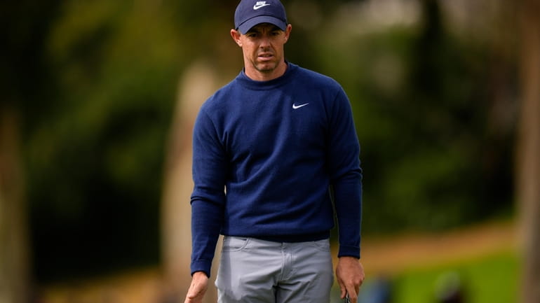 Rory McIlroy, of Northern Ireland, waits to putt on the...