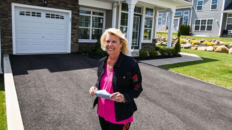 Lorraine Pizzo, stands in front of the villa she plans...