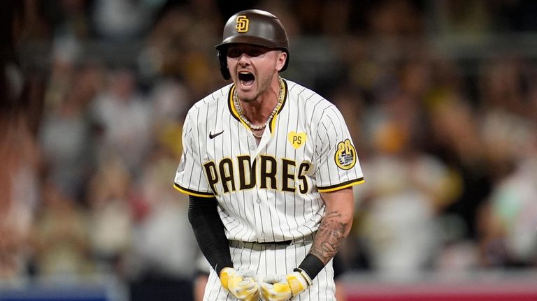 San Diego Padres' Jackson Merrill celebrates after hitting a three-RBI...