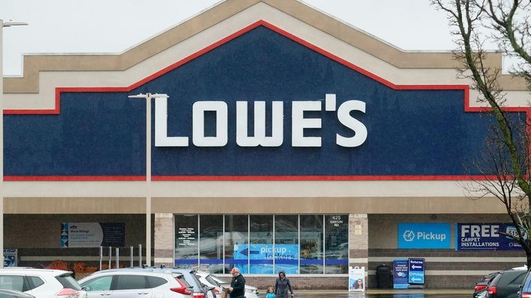 Shoppers exit a Lowe's in Warrington, Pa., Feb. 4, 2022.