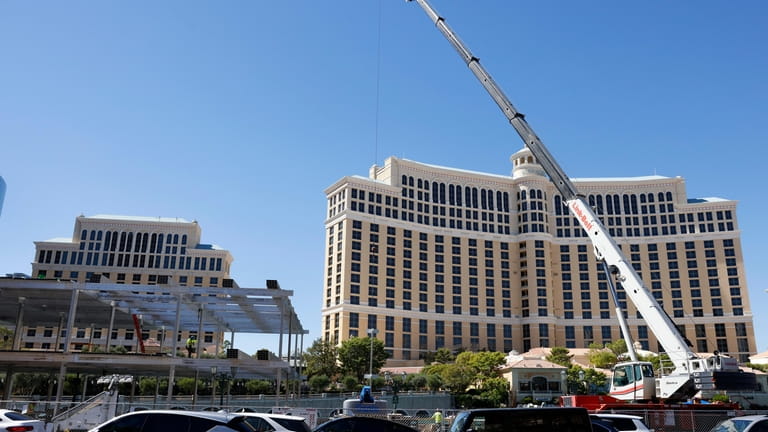 Vehicles pass a Formula One construction site at the Bellagio...